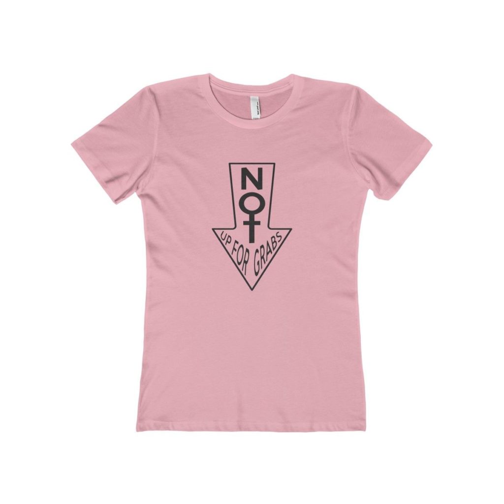 a pink fitted shirt with an arrow pointing down with a phrase against Donald Trump
